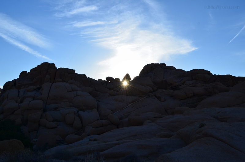 sun flare through rocks Joshua Tree National Park